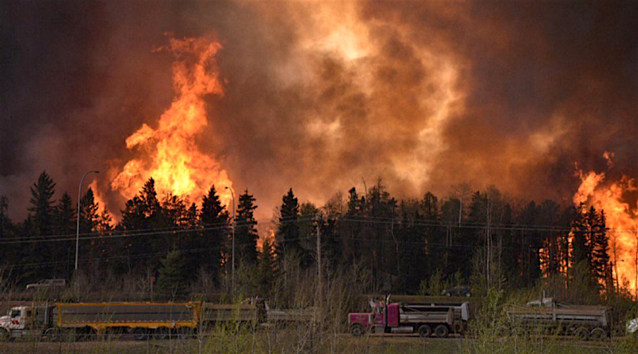 Canada’s oil sands cuts production as wildfire forces mass evacuation