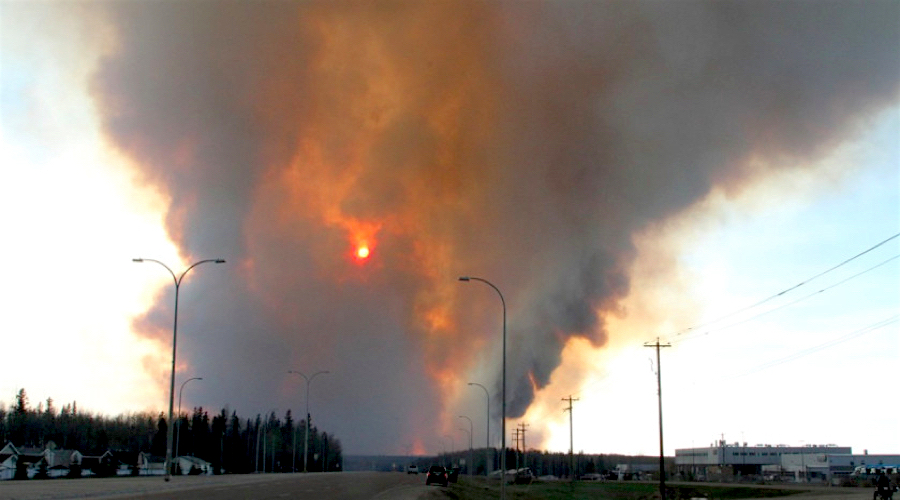 Canadian oil sands camps evacuated as wildfire shifts north