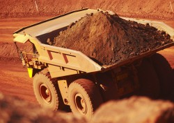 BHP hits record iron ore output but warns of risks from virus