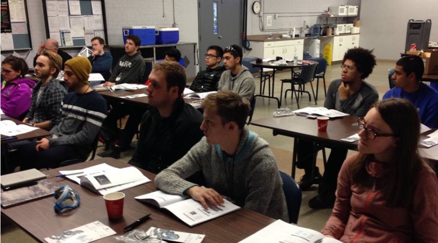 University of Toronto mining engineering students listen to presentations about screening, including vibrating screens, methods, definitions and history.