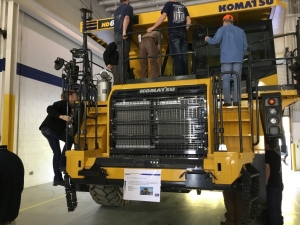 Students explore a Komatsu HD605-8