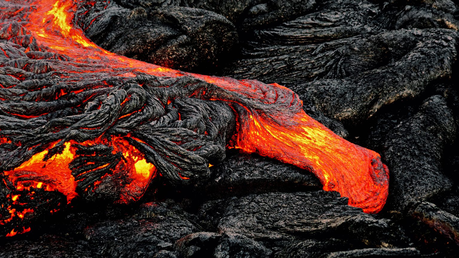 glowing-lava-emerges-from-a-column-of-the-earth-mining-com