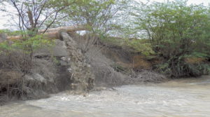 Coal ash being released into a pond