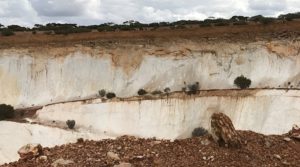 Exposed white kaolinite in the pit wall at the Mt Gibson Wombat Gold Project in the Yilgarn Craton of Western Australia. Credit: CSIRO