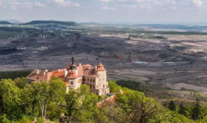 Jezeří Castle in the Czech Republic is a cultural heritage site located on the outskirts of a coal mine, saved from demolition due to mining. Its preservation is an important part of the regional transition away from mining.