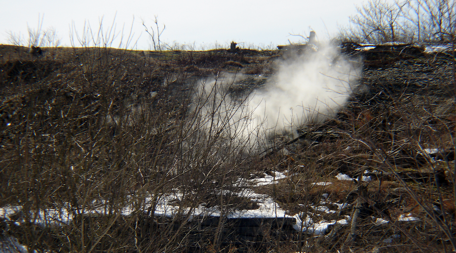 A plume of steam wafts from the ground at the Centralia mine fire.