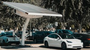 EVs charging under solar panels.