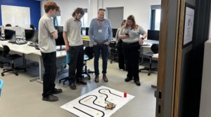 Richard Christensen from RAICo overseeing a robot demonstration with students from Energy Coast University Technical College (UTC)-min